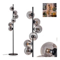 Solution lumineuse Noir et Ambre au dessin sobre en format lampadaire 25 W IP20 E14